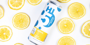 Hi5 Cannabis drink Lemon Flavored sitting on a white background with lemons